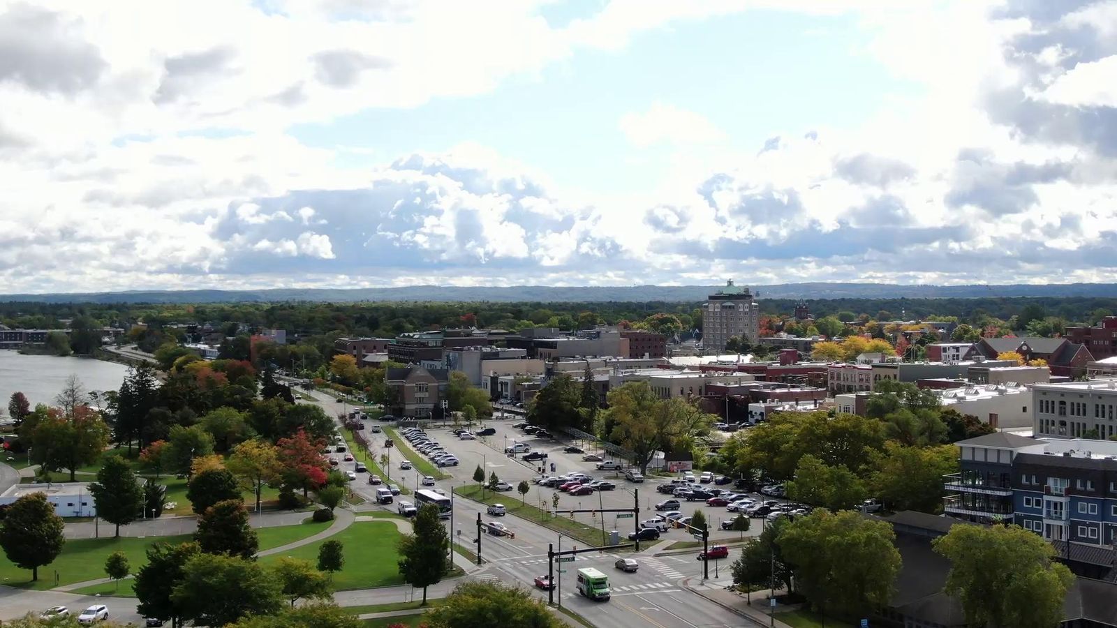 Aerial view of a downtown city with buildings, streets, and trees visible